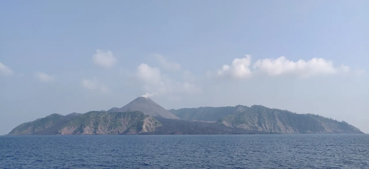 Barren Island's active volcanic cone rising above the Andaman Sea