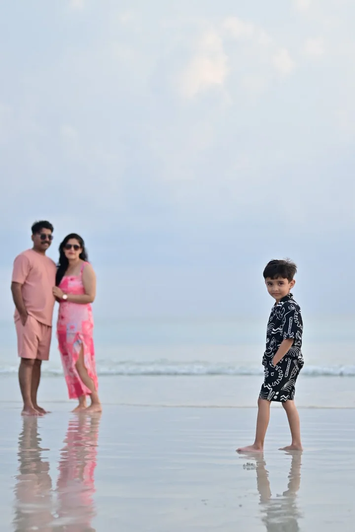 A family sharing a joyful moment beside the sea
