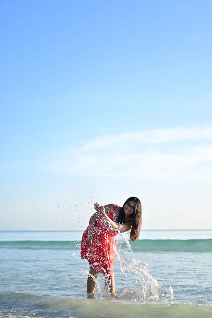A guest splashing in the turquoise Andaman Sea