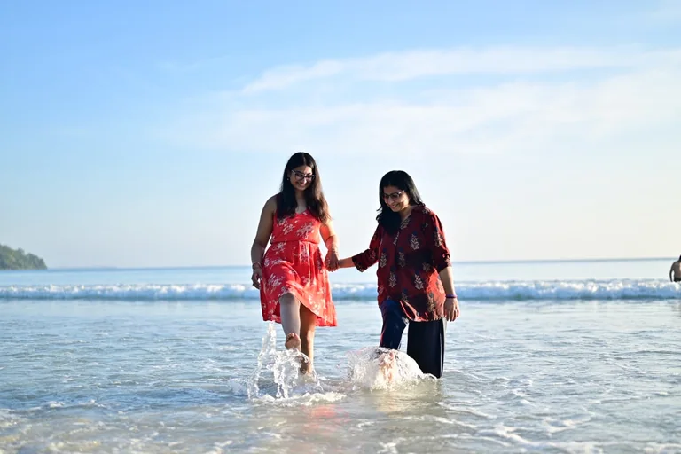 Guests laughing and splashing together at the beach