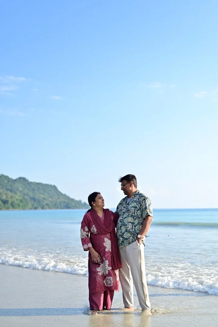 A couple enjoying a sunny walk along an Andaman beach