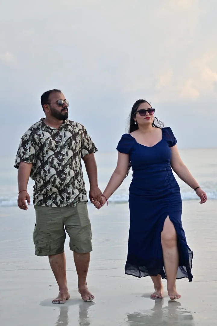 Guests strolling together beside the turquoise Andaman Sea