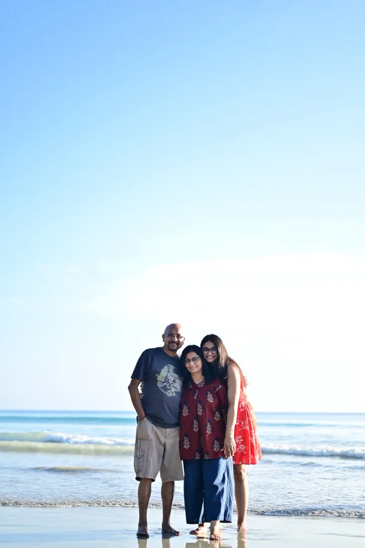 A family smiling together during an Andaman beach holiday