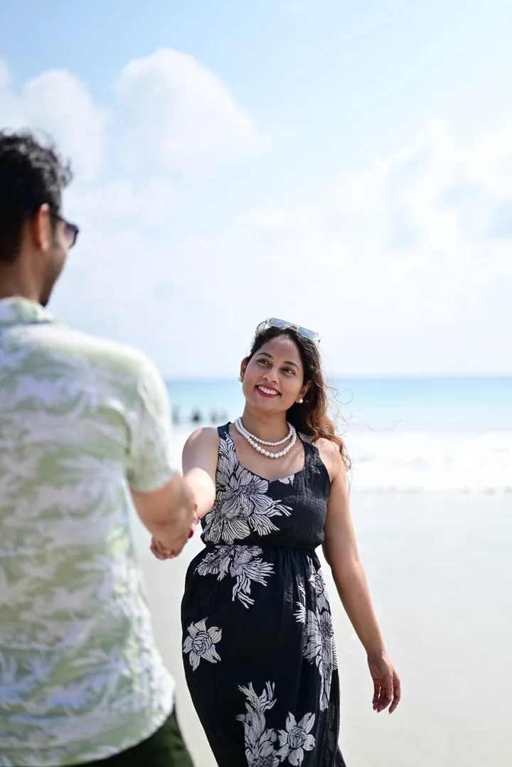 A couple enjoying a close moment on a tropical beach
