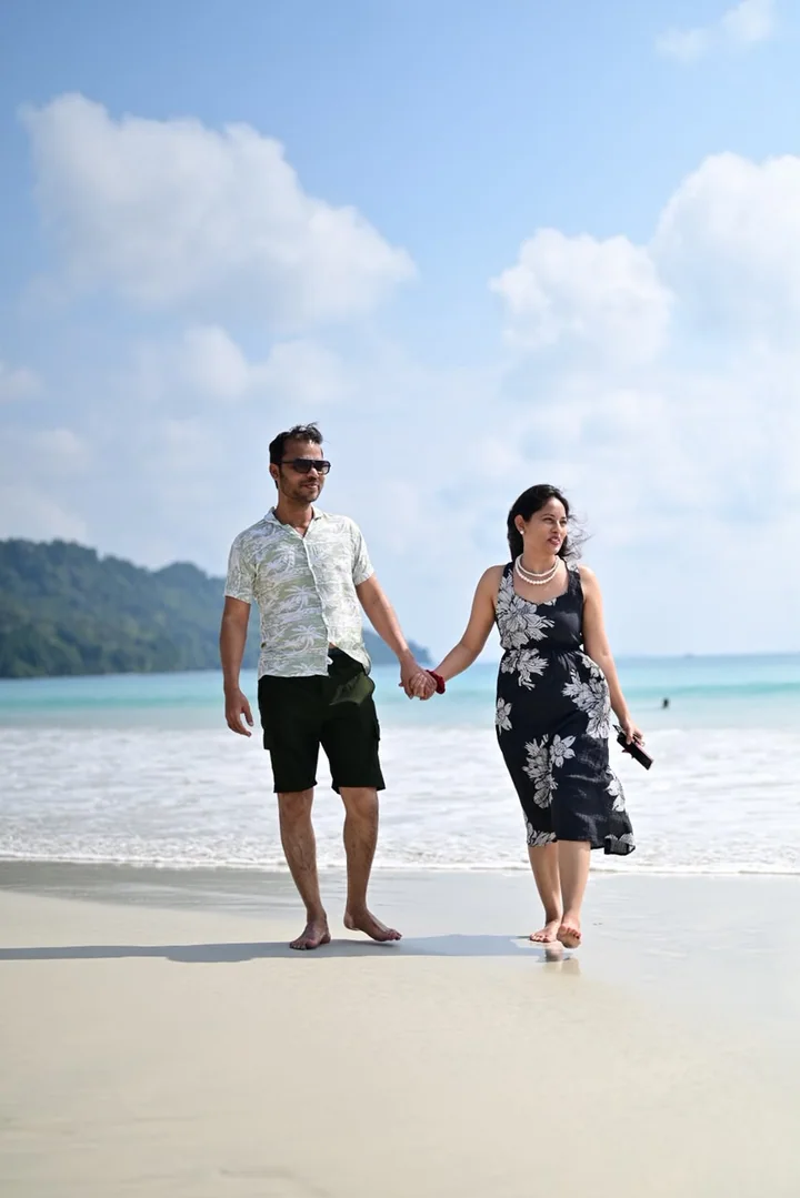 A couple walking together along an Andaman beach